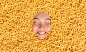 large-pile-uncooked-pasta-around-happy-womans-face-noodles-made-durum-wheat-1030×687-1-1